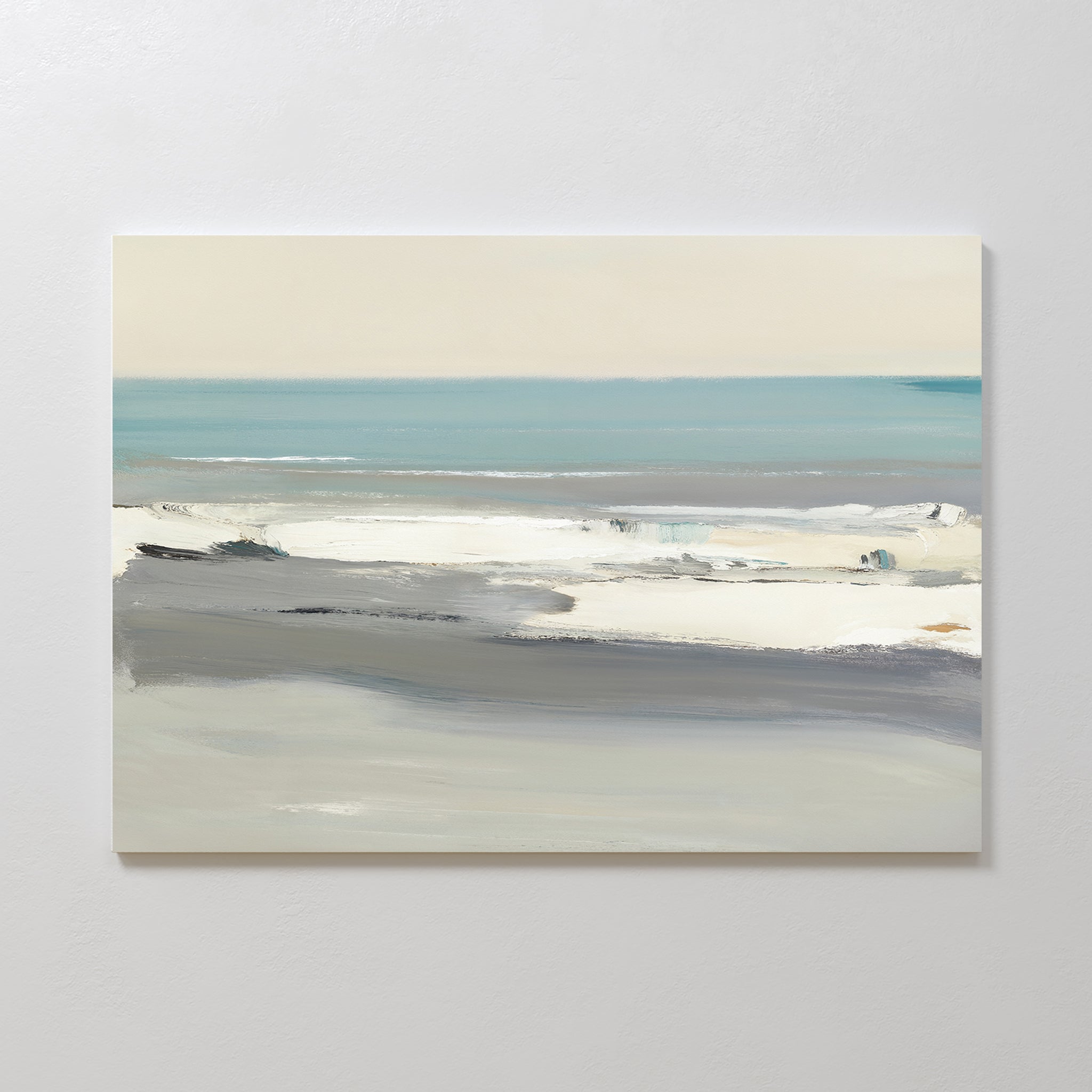 Sandy Retreat Canvas Art - Horizontal: A minimalist coastal seascape with soft blue, gray, and white tones, depicting gentle waves and a calm ocean beneath a pale sky; ideal for mounting on a white wall.