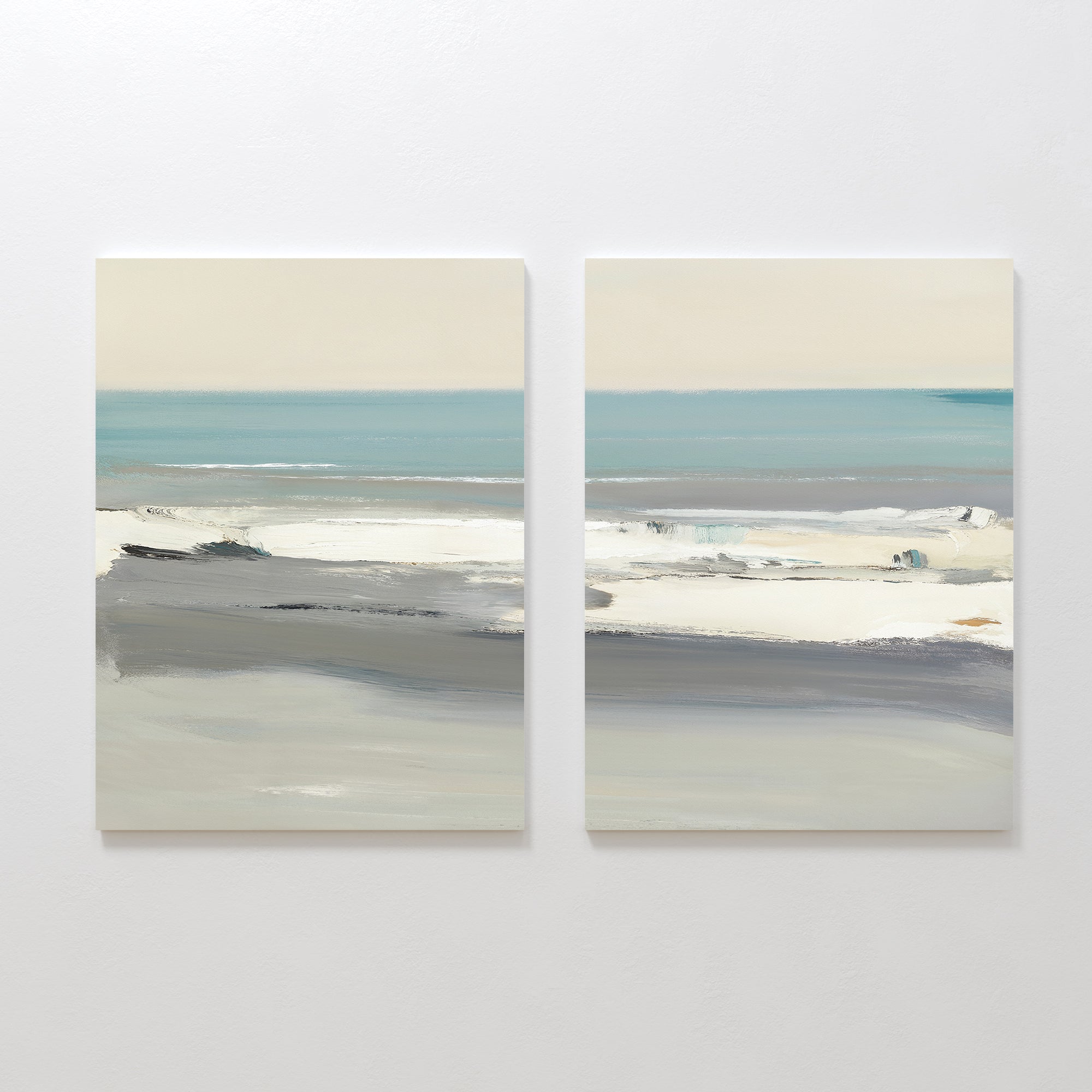 The Sandy Retreat - Set Of 2 features abstract paintings of calm seascapes in soft blue, gray, and white tones. Visible horizons and smooth brushstrokes evoke tranquil coastal vibes across both charming canvases.