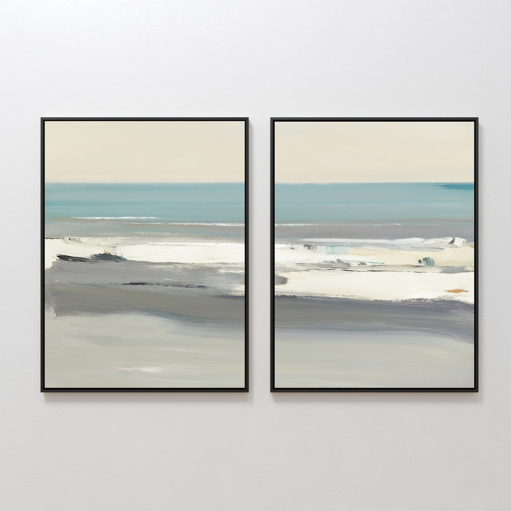 The Sandy Retreat - Set Of 2 features framed abstract beachscape art in soft blue, gray, and beige tones, depicting calm ocean waves and a serene beach under a pale sky, displayed side by side on a white wall.