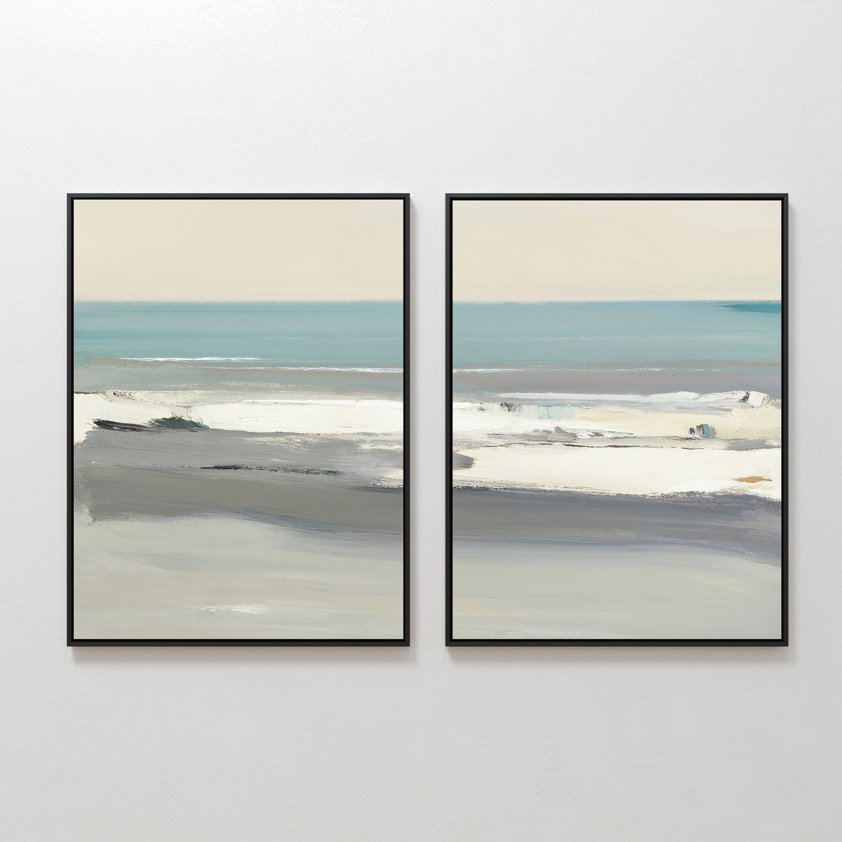 The Sandy Retreat - Set Of 2 features framed abstract beachscape art in soft blue, gray, and beige tones, depicting calm ocean waves and a serene beach under a pale sky, displayed side by side on a white wall.