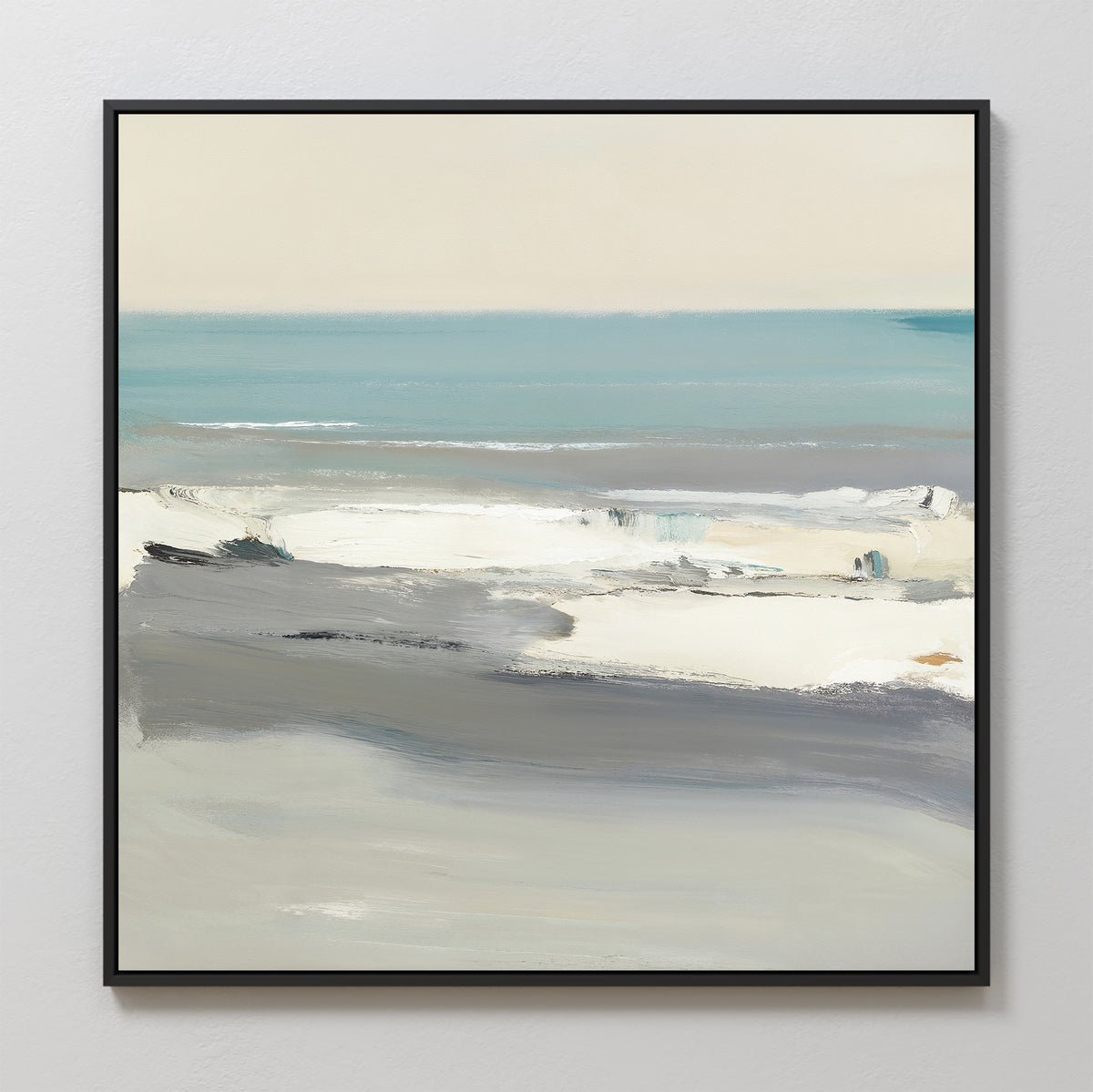 Sandy Retreat Canvas Art - Square features an abstract coastal seascape in muted blue, gray, and white tones. Framed with a slim black border, it brings soft seaside vibes and a serene atmosphere to your space.