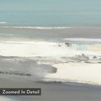 The Sandy Retreat Canvas Art - Square features an abstract, zoomed-in design with soft layers of blue, gray, white, and beige that evoke gentle coastal waves and sandy shores. "Zoomed In Detail" appears in the bottom left corner.