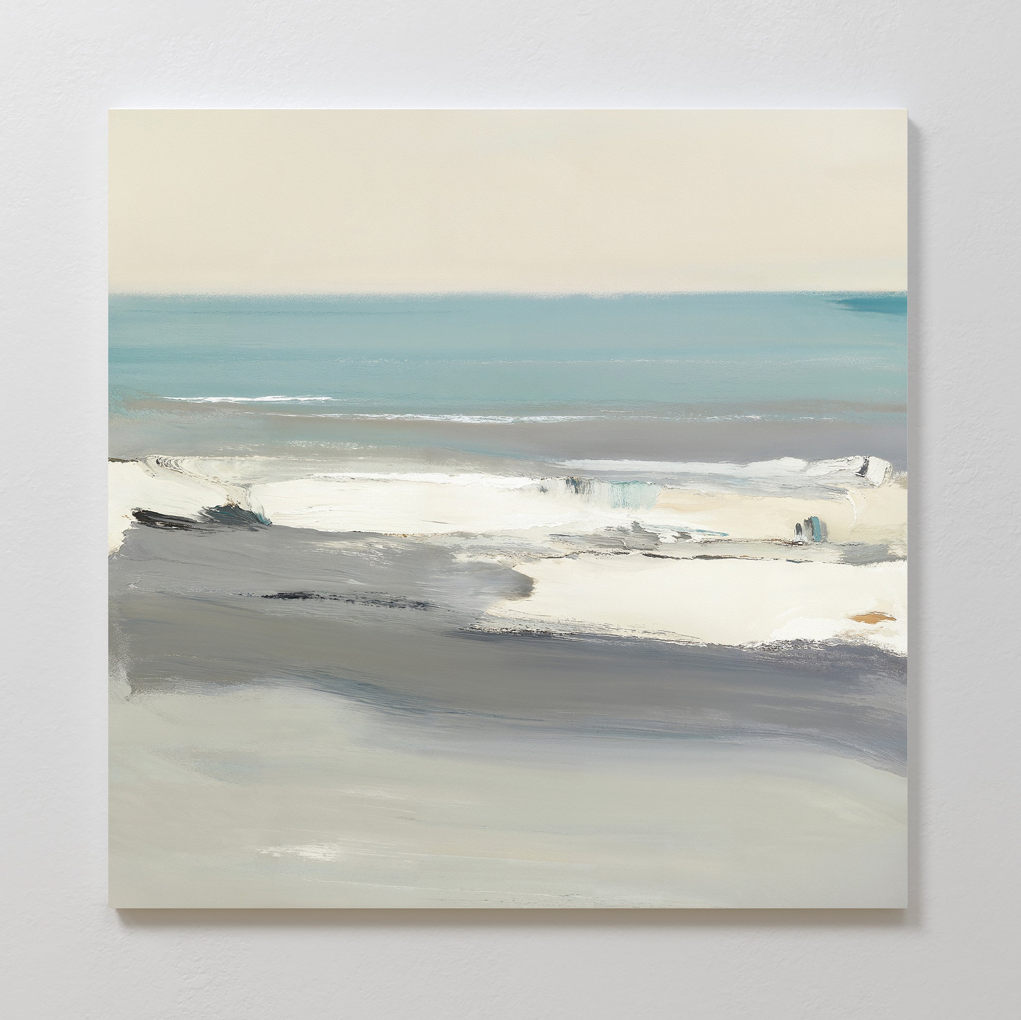 The Sandy Retreat Canvas Art - Square features an abstract seascape in soft blue, gray, white, and beige tones, with broad, blended brushstrokes evoking waves, shoreline, and sky for a tranquil coastal feel.