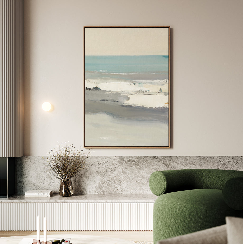 A minimalist living room featuring a green armchair, marble surfaces, dried flowers in a vase, and the Sandy Retreat Canvas Art - Vertical above the built-in shelf adds subtle seaside vibes to the space.