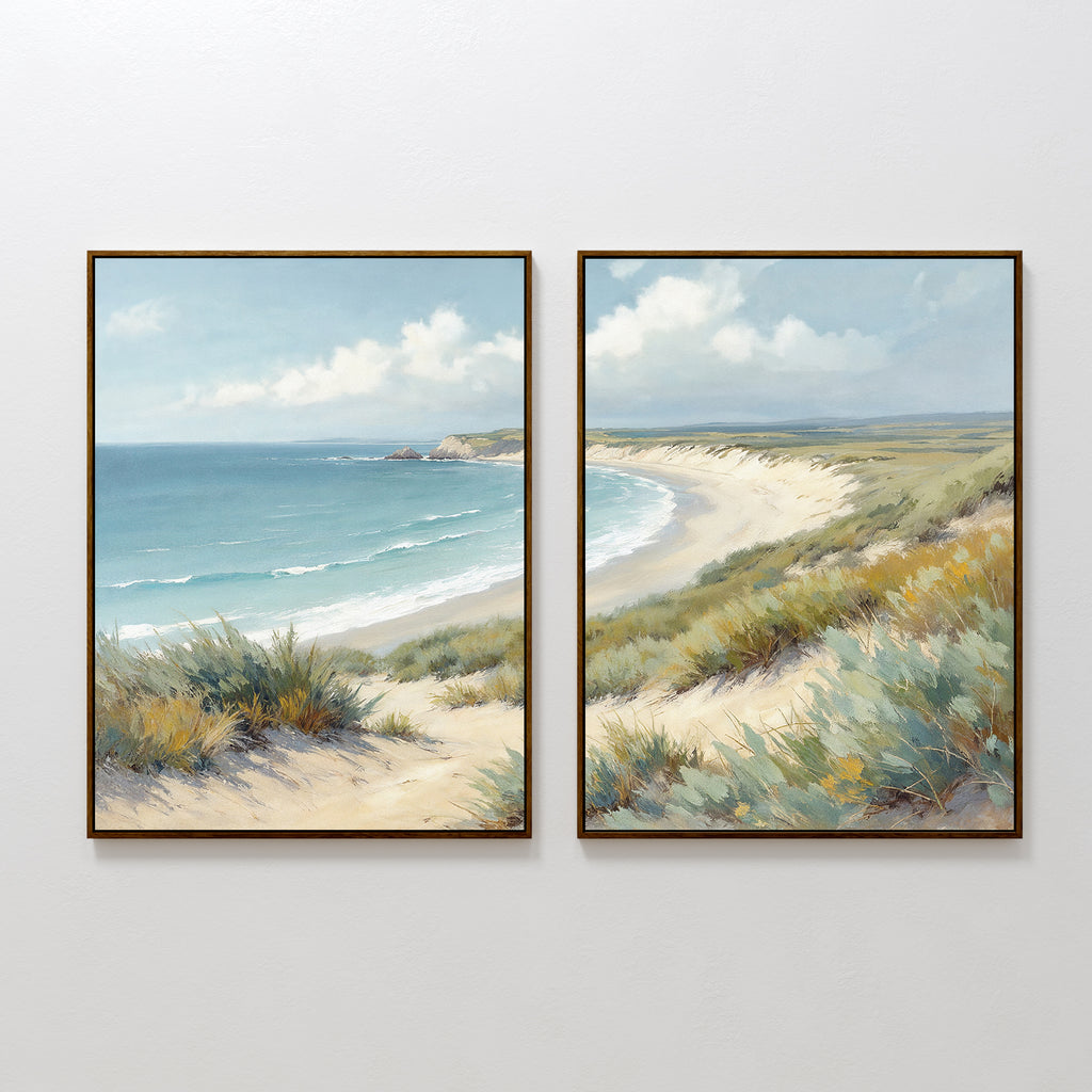 The "Sandy Shores - Set of 2" features framed coastal landscape art with sandy dunes and blue waves beneath a partly cloudy sky—perfect beach wall art for serene home decor.