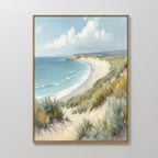 The Sandy Shores Canvas Art - Vertical features a framed coastal landscape with sandy beach, green grasses, blue ocean waves, and a partly cloudy sky—perfect beach wall art for any room.