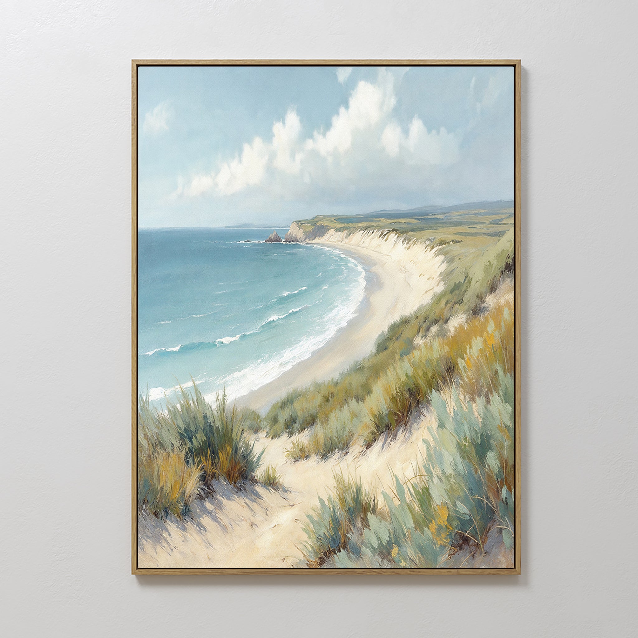The Sandy Shores Canvas Art - Vertical features a framed coastal landscape with sandy beach, green grasses, blue ocean waves, and a partly cloudy sky—perfect beach wall art for any room.