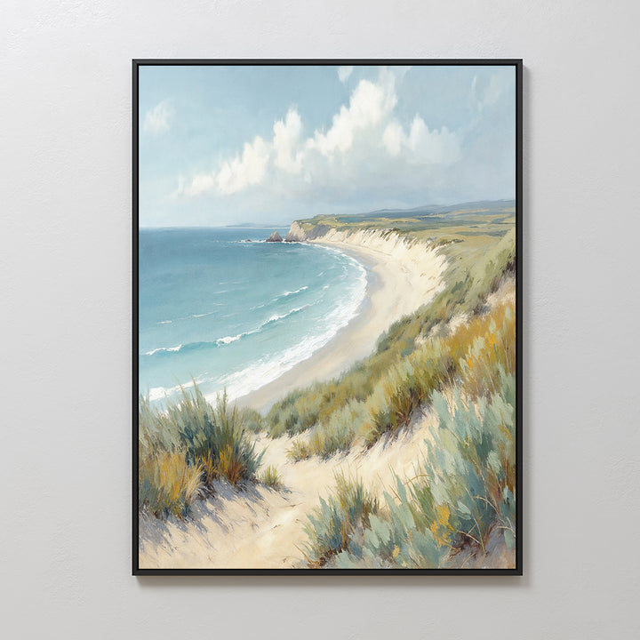 The Sandy Shores Canvas Art - Vertical features a coastal scene of sandy beach, grassy dunes, waves, and blue sky with clouds—an ideal piece of beach wall art for brightening up any space.