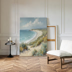 The Sandy Shores Canvas Art - Vertical rests against a white-paneled wall in a minimal room with a wooden chair, small round table with candles and books, and wood herringbone floor.