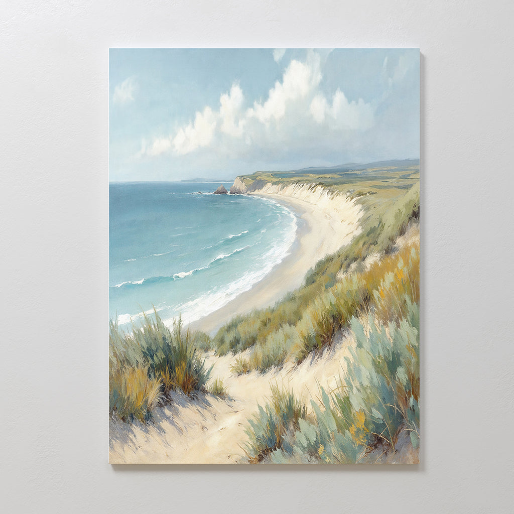 Sandy Shores Canvas Art - Vertical features a serene coastal scene of sandy beach, gentle waves, and grassy dunes beneath a cloudy sky—perfect wall art to bring tranquility to any space.