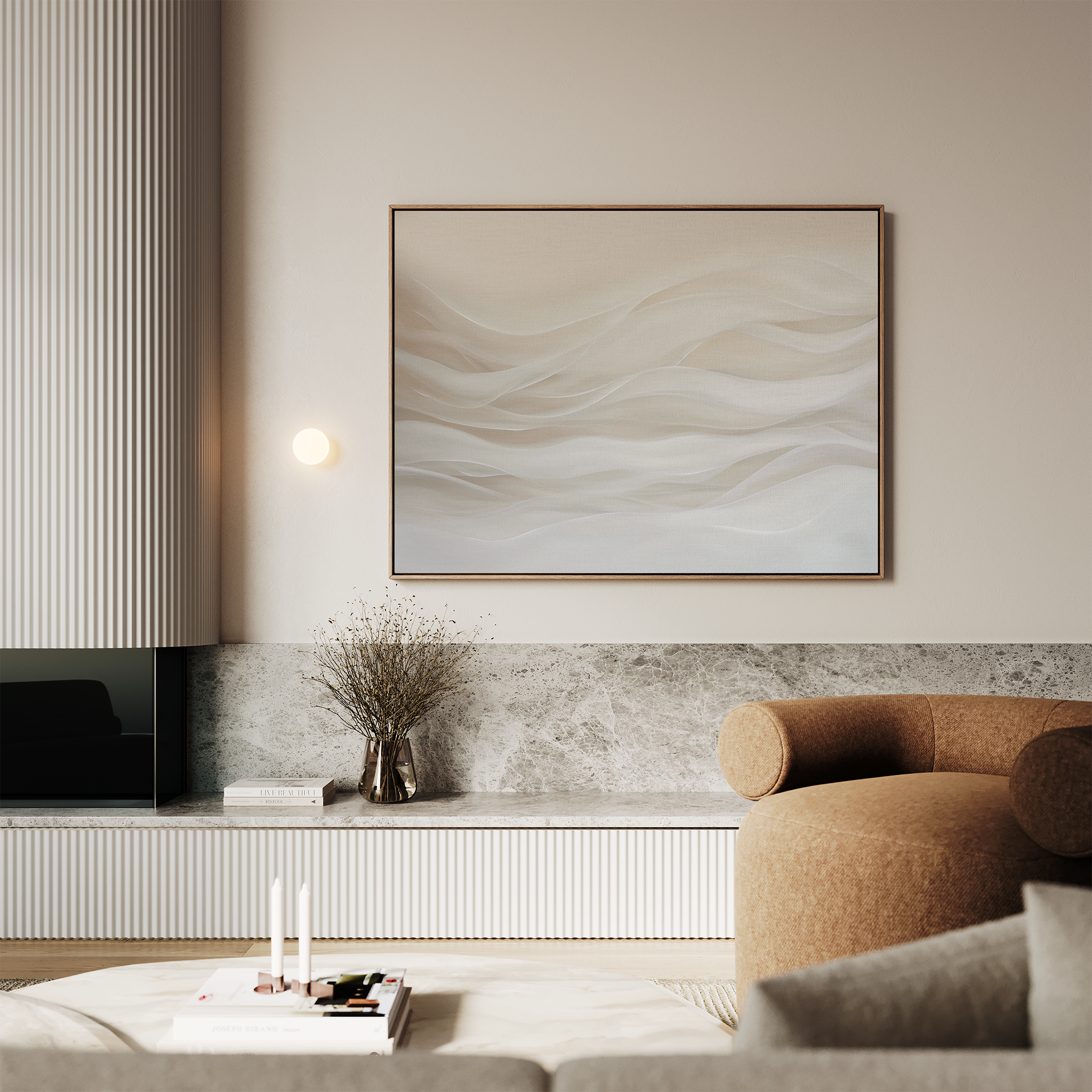 A modern living room with neutral tones, featuring a beige curved sofa, a marble coffee table with books and candles, a minimalist wall sconce, a vase with dried flowers, and the Sandy Hues Abstract Canvas Art on the wall.