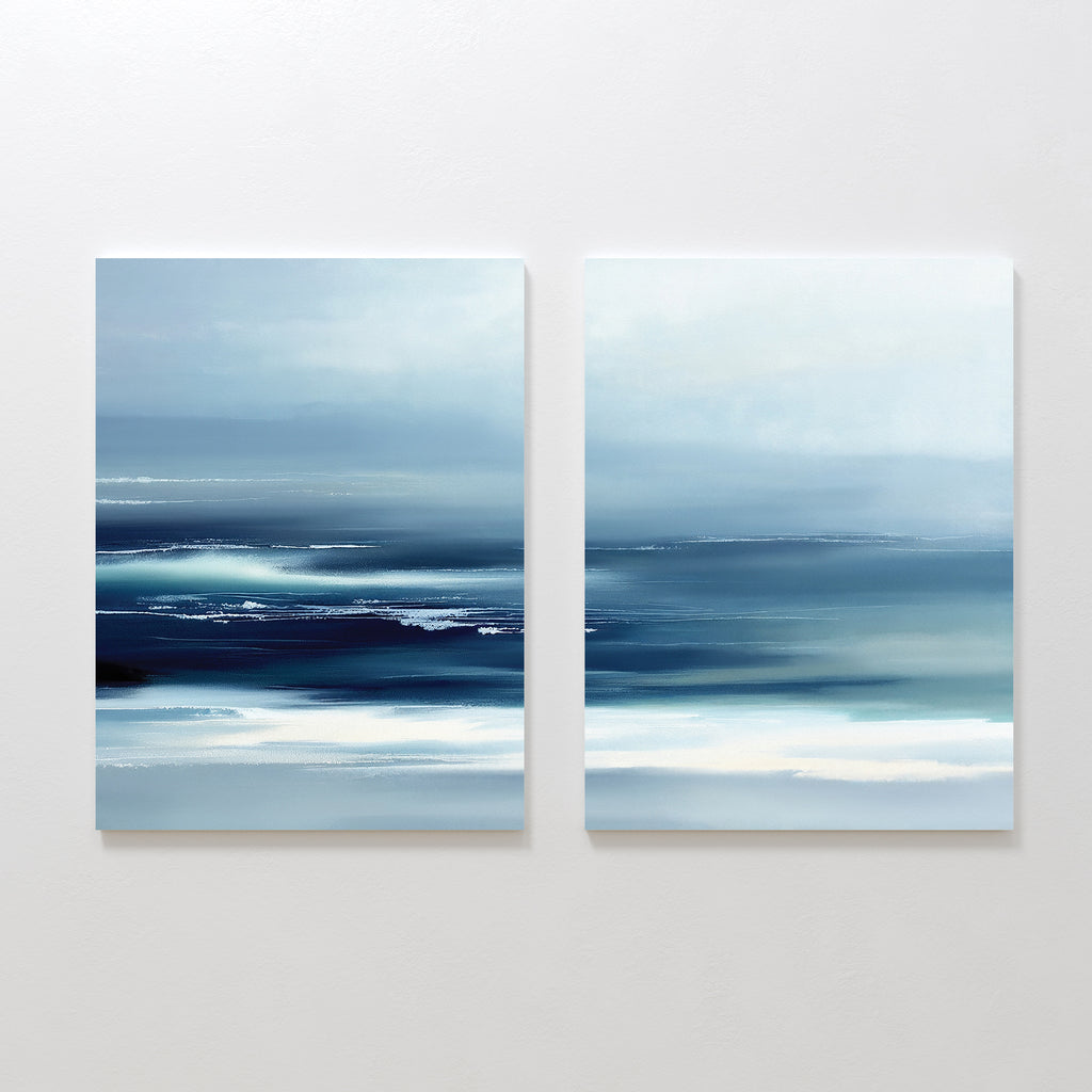 The Sapphire Current - Set Of 2 features abstract prints with blue, white, and teal tones, blending soft horizontal lines to evoke a calm, misty seascape. Displayed together, these artworks add serene elegance to any wall.
