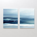 The Sapphire Current - Set Of 2 features abstract prints with blue, white, and teal tones, blending soft horizontal lines to evoke a calm, misty seascape. Displayed together, these artworks add serene elegance to any wall.