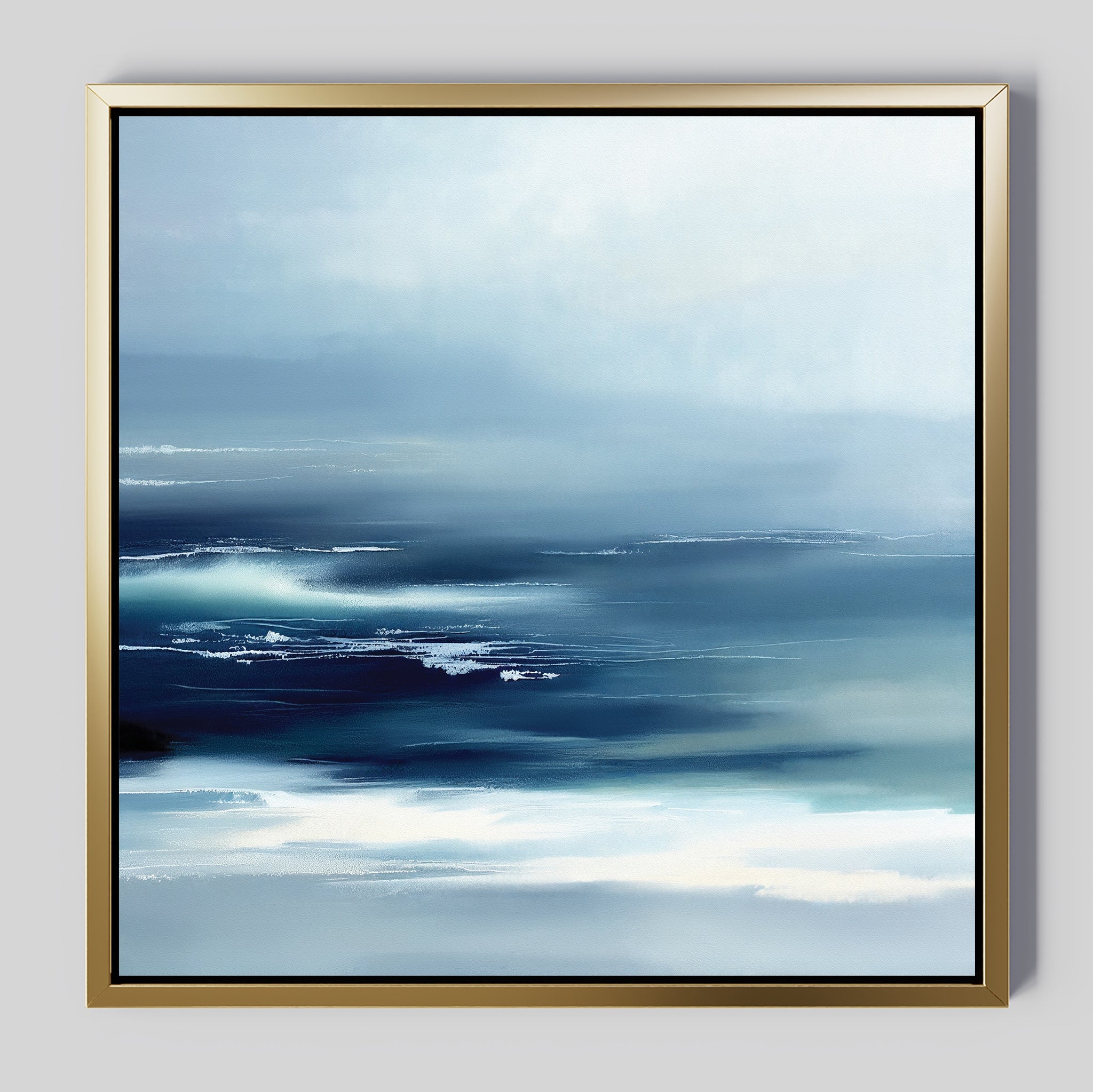 The Sapphire Current Canvas Art - Square is a serene abstract painting with soft blue, white, and navy hues reminiscent of an ocean scene. Its gold frame with a black inner edge adds a touch of elegance to any space.