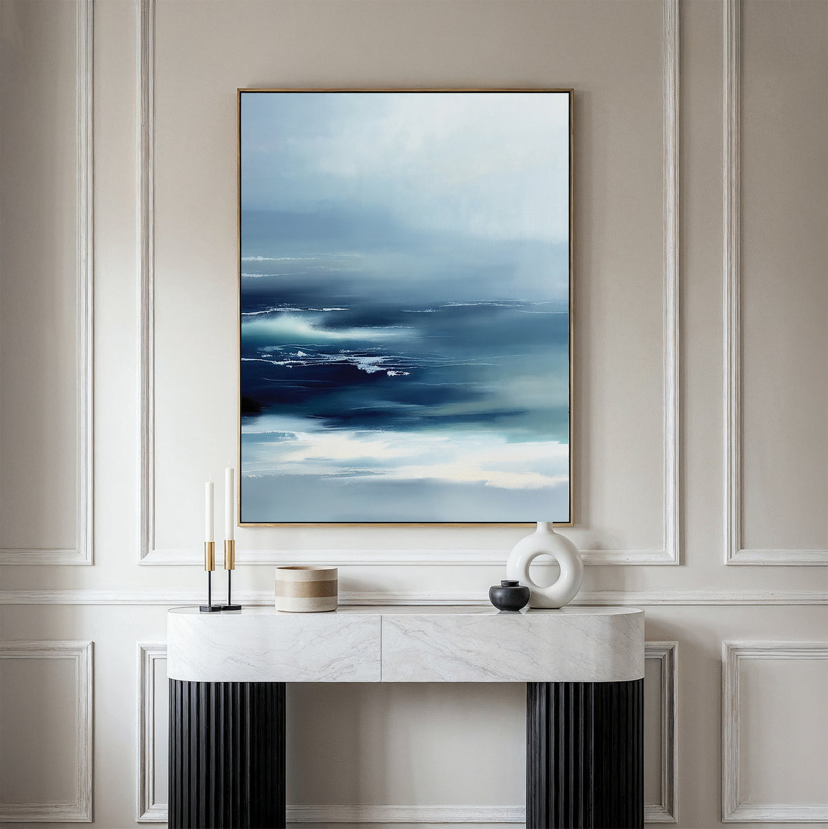A minimalistic entryway is styled with a white console table, modern decor, and the Sapphire Current Canvas Art - Vertical displayed on the beige paneled wall.