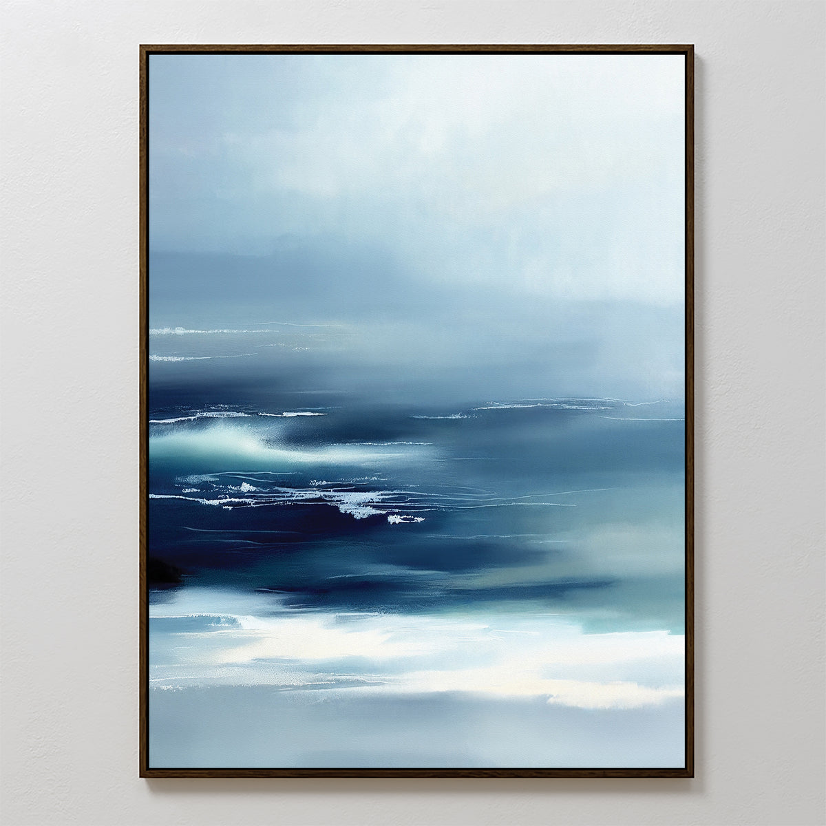 The Sapphire Current Canvas Art - Vertical features soft blue and white gradients reminiscent of ocean waves under a pale sky, framed in thin dark wood. This abstract print brings Nordic Park serenity and tranquil style to any space.