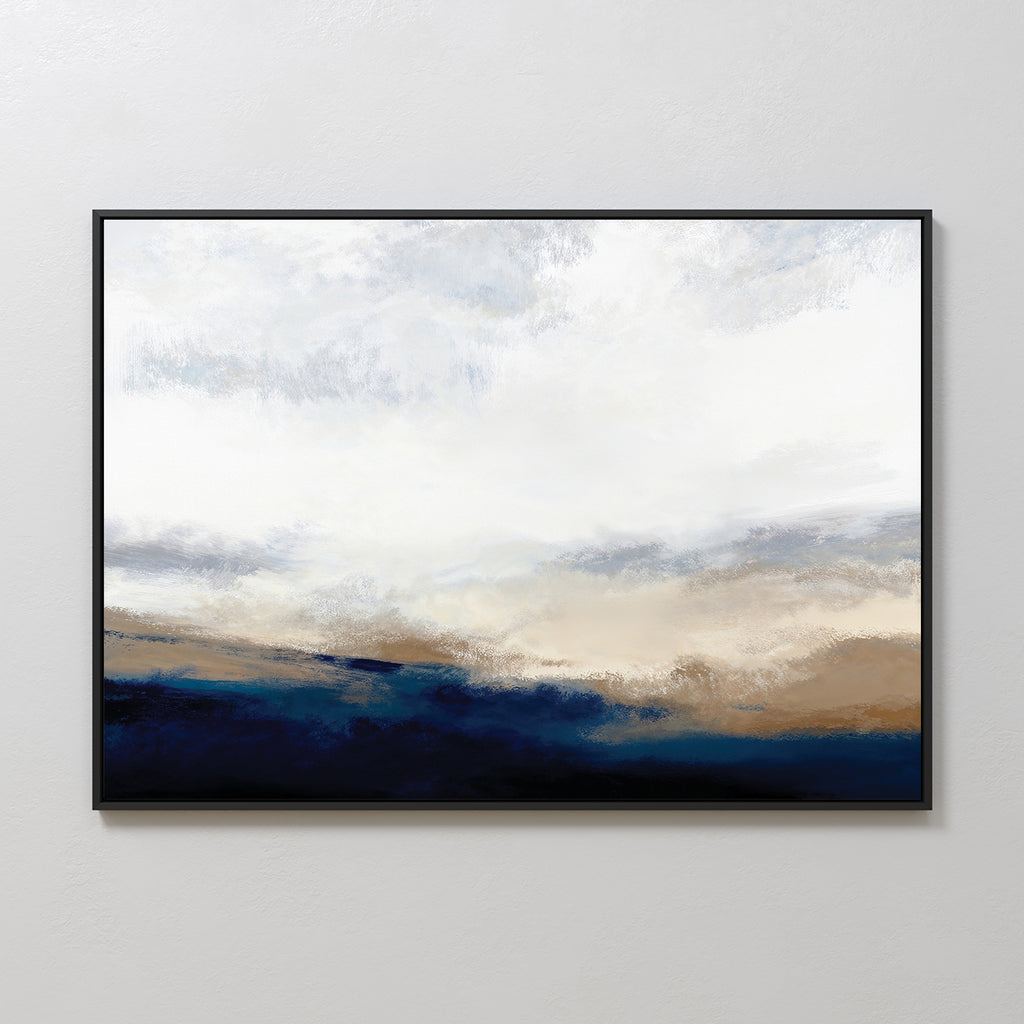 Sapphire Tides Canvas Art - Horizontal features soft brushstrokes and a white-gray sky above deep blue and tan hues, creating serene cobalt tones. This modern wall decor comes framed in black, ideal for hanging on a light-colored wall.
