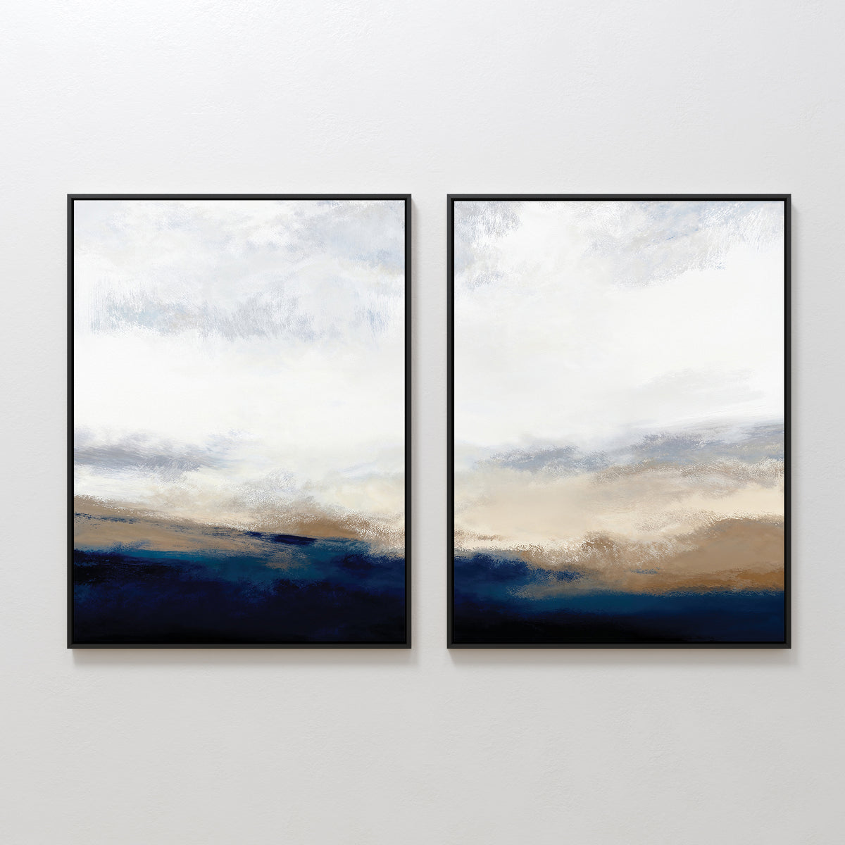 The Sapphire Tides - Set Of 2 features abstract landscape prints in black frames, showcasing soft strokes of cobalt blue, beige, and white—an ideal way to add serene style to any modern living room or space.