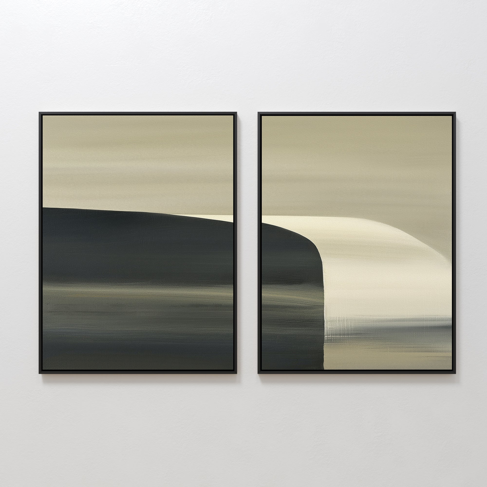 The Sculptural Forms - Set Of 2 features two framed abstract artworks with minimalist compositions of soft, horizontal gradients in beige, cream, and dark gray, and smooth brushstrokes, displayed side by side on a white wall.