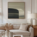 A modern living room with minimalist decor: a light beige sofa, neutral throw pillows, a wooden side table topped with a ceramic lamp and dried flowers, and the Sculptural Forms Canvas Art - Square displayed on the wall.