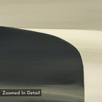 A detailed close-up of the Sculptural Forms Canvas Art - Square, showcasing overlapping curved shapes in beige, black, and gray on a textured canvas—ideal for modern or minimalist spaces. The text Zoomed In Detail is shown at the bottom left.