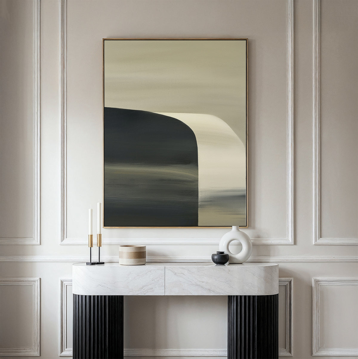 A modern console table with a marble top holds a white vase, candle holder, and small box for a minimalist look. Above it hangs the Sculptural Forms Canvas Art - Vertical on a beige wall with decorative molding.