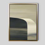 The Sculptural Forms Canvas Art - Vertical features a minimalist abstract design with muted beige and dark gray tones, a curved sculptural form on the left, fading into lighter shades on the right, all set within a gold frame against a gray background.