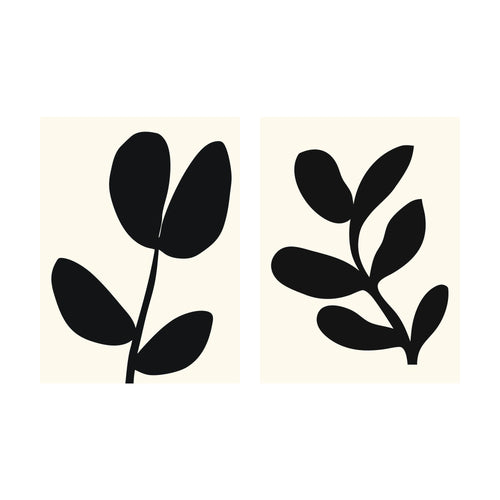 Two rectangular Black Leaf art prints, each featuring a minimalist black leaf silhouette against a cream background.