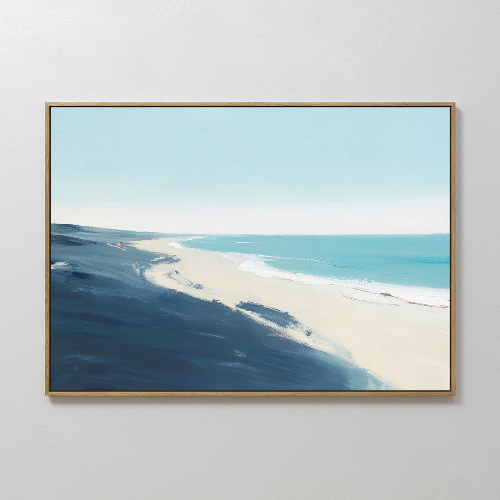 Shifting Tides Canvas Art - Horizontal showcases a serene beachscape with soft blue sky, turquoise ocean, gentle waves, and dark blue dunes—ideal framed wall art to enhance any plain white wall.