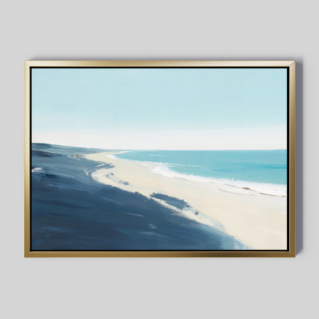 The Shifting Tides Canvas Art - Horizontal features a serene beach scene with sandy shoreline, gentle waves, deep blue cliffs on the left, and a clear sky—capturing coastal tranquility in framed wall art.