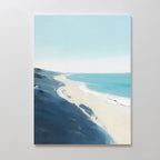 The Shifting Tides Canvas Art - Vertical features a minimalist seaside scene with soft blue sky, white sand, and gentle waves. Loose brushstrokes blend blues and sandy tones, creating a calm and serene coastal accent for your space.