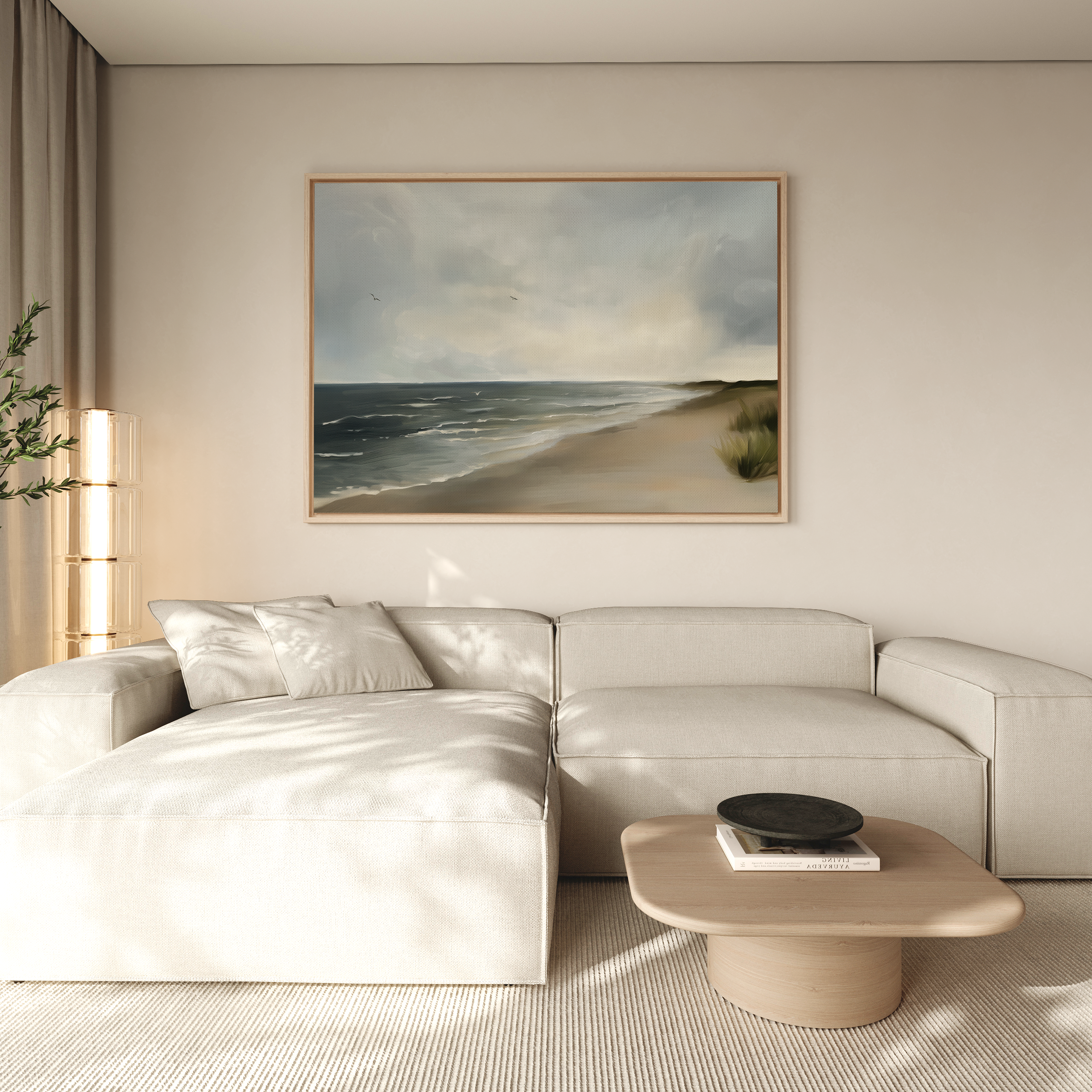 A modern living room with a light beige sectional, a low wooden coffee table, and the Shoreline Calm Canvas Art above the sofa. Soft natural light and neutral tones create a serene coastal décor vibe.