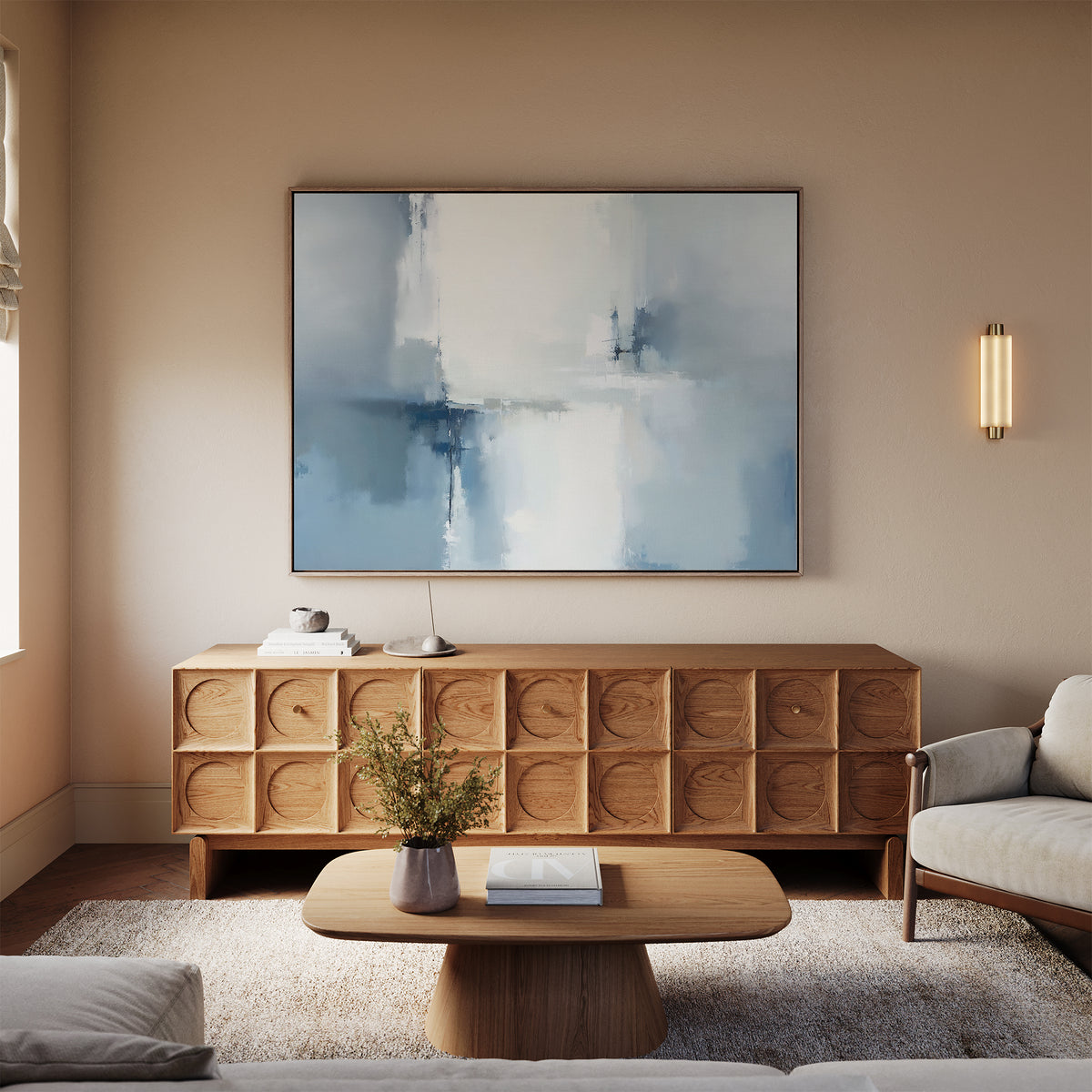 A modern living room features a wooden sideboard with carved patterns, the Silver Cross Formation Canvas Art - Horizontal above it, a light wood coffee table, beige sofa, and wall sconce, all in soft neutral tones.