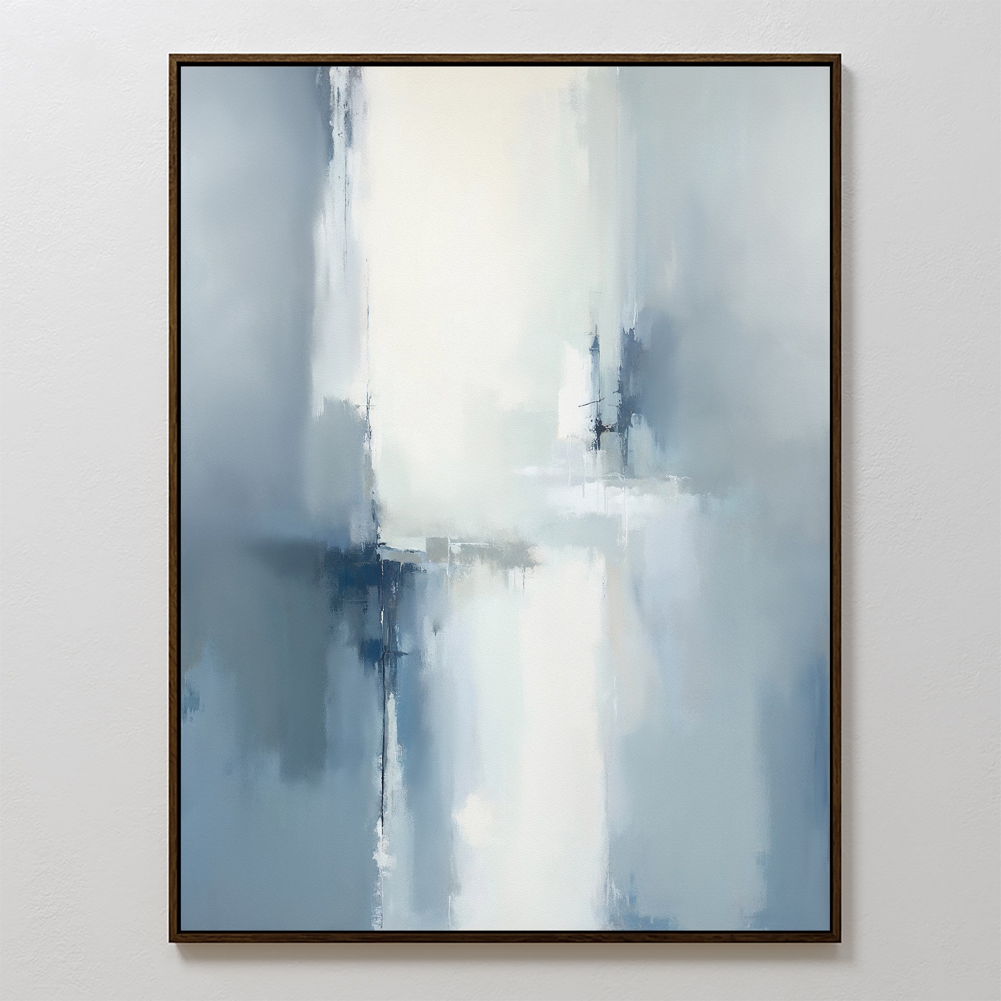 The Silver Cross Formation Canvas Art – Vertical features soft, blurred shades of blue, white, and gray with intersecting brushstrokes. This modern abstract print comes framed with a thin dark border, perfect for enhancing any contemporary living room.