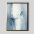 Silver Cross Formation Canvas Art - Vertical, framed in gold, showcases soft blue, gray, and white hues with crosshatched brushstrokes. This serene piece adds a tranquil touch to modern living rooms, especially on light gray walls.