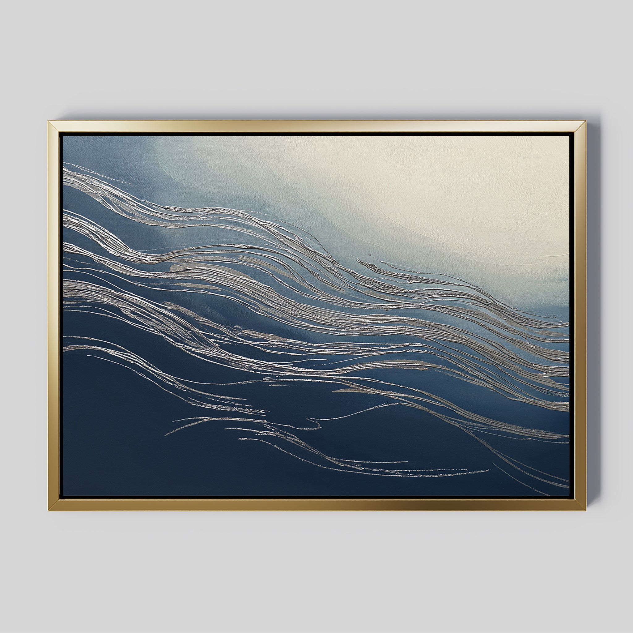 The Silver Current Canvas Art - Horizontal features wavy metallic ribbons on a gradient background from dark blue to light cream, all framed in gold for a sophisticated contemporary accent to any space.