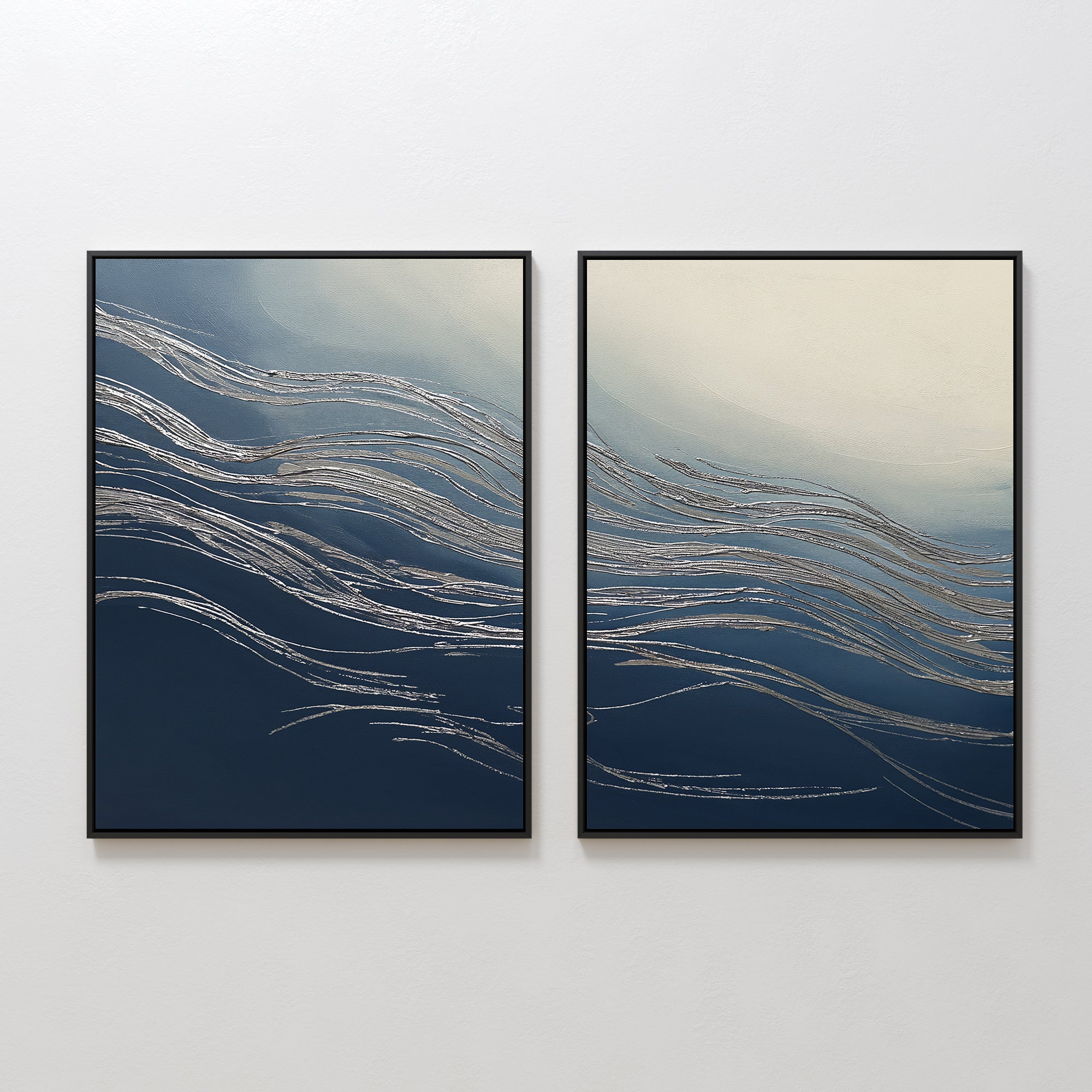Silver Current - Set Of 2: abstract prints with flowing silver lines on blue and white backgrounds, paired in sleek black frames—perfect wall art for adding contemporary sophistication to any space.