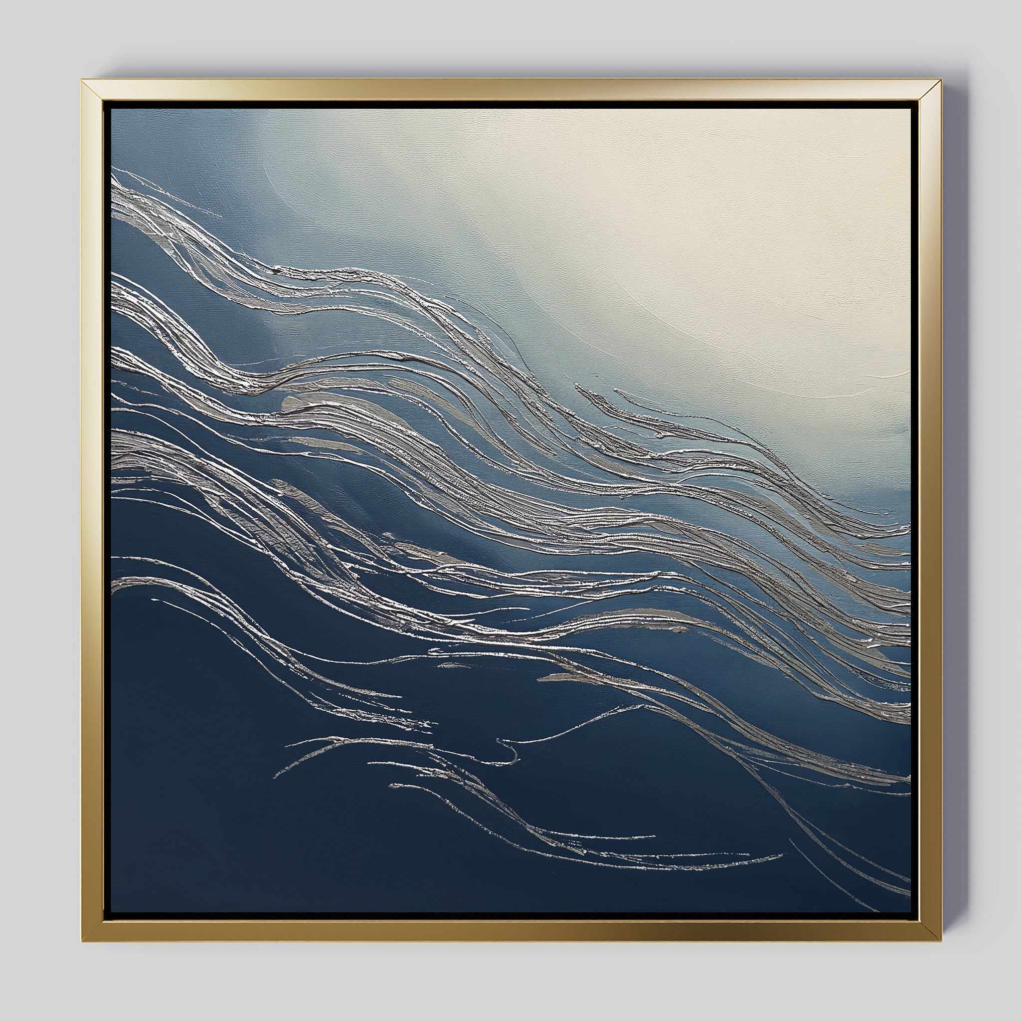 The Silver Current Canvas Art - Square features flowing silver lines over blue and white gradients with a gold frame, bringing contemporary elegance and a sense of movement reminiscent of waves or wind to your space.