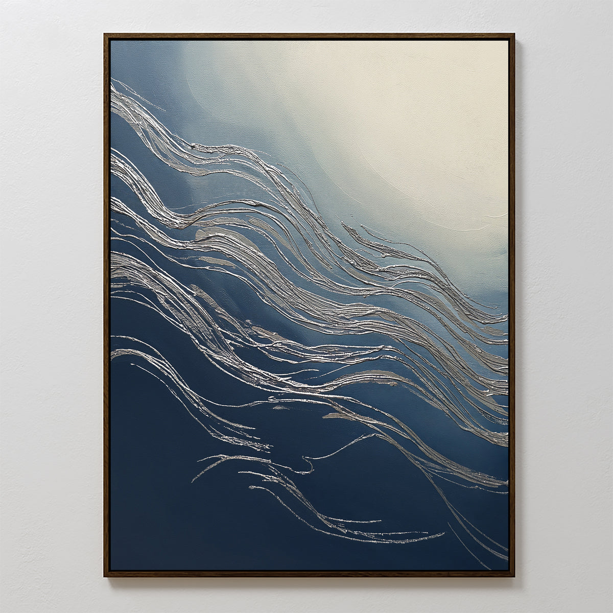 Silver Current Canvas Art - Vertical features flowing silver lines over a gradient from deep blue to soft cream, framed in a slim dark border. This abstract print evokes contemporary elegance with its wave-like, motion-inspired design.