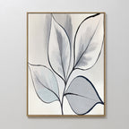 Silver Leaves Canvas Art - Vertical features abstract leaves with black outlines in gray, blue, and white tones. Set in a thin gold frame on a light wall, it’s ideal for modern home decor.