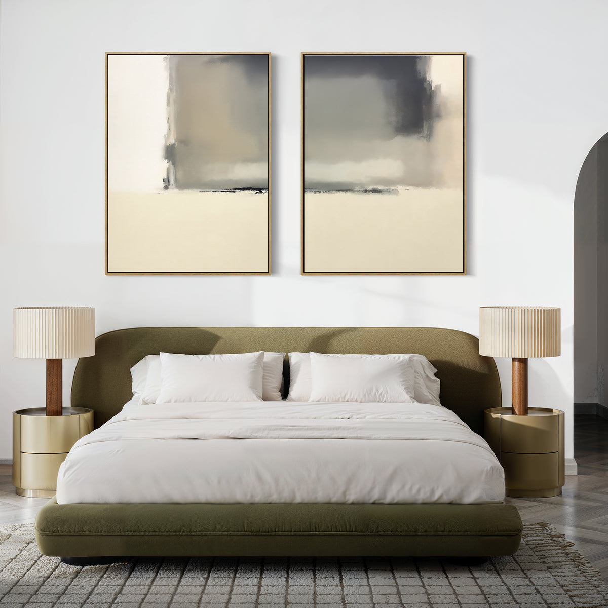 A modern bedroom with a curved olive-green bed, white bedding, two round gold nightstands topped with Smoke Boundary - Set Of 2 pleated lamps, and large abstract wall art above the headboard. A textured rug covers the floor.