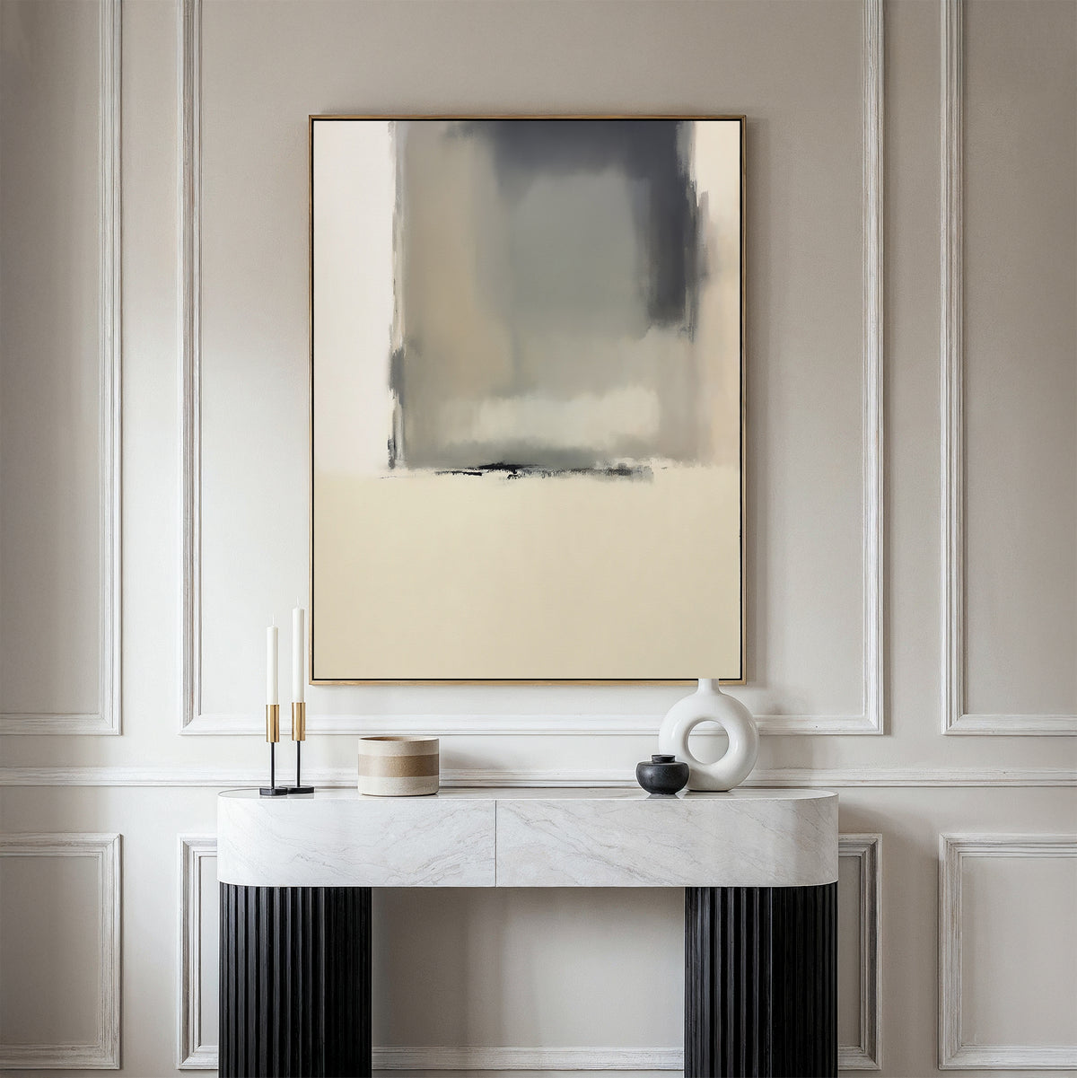 A modern, minimalist room features light paneled walls and a marble console table with black legs. The Smoke Boundary Canvas Art - Vertical in neutral tones hangs above, complemented by candles and ceramic decor for added elegance.