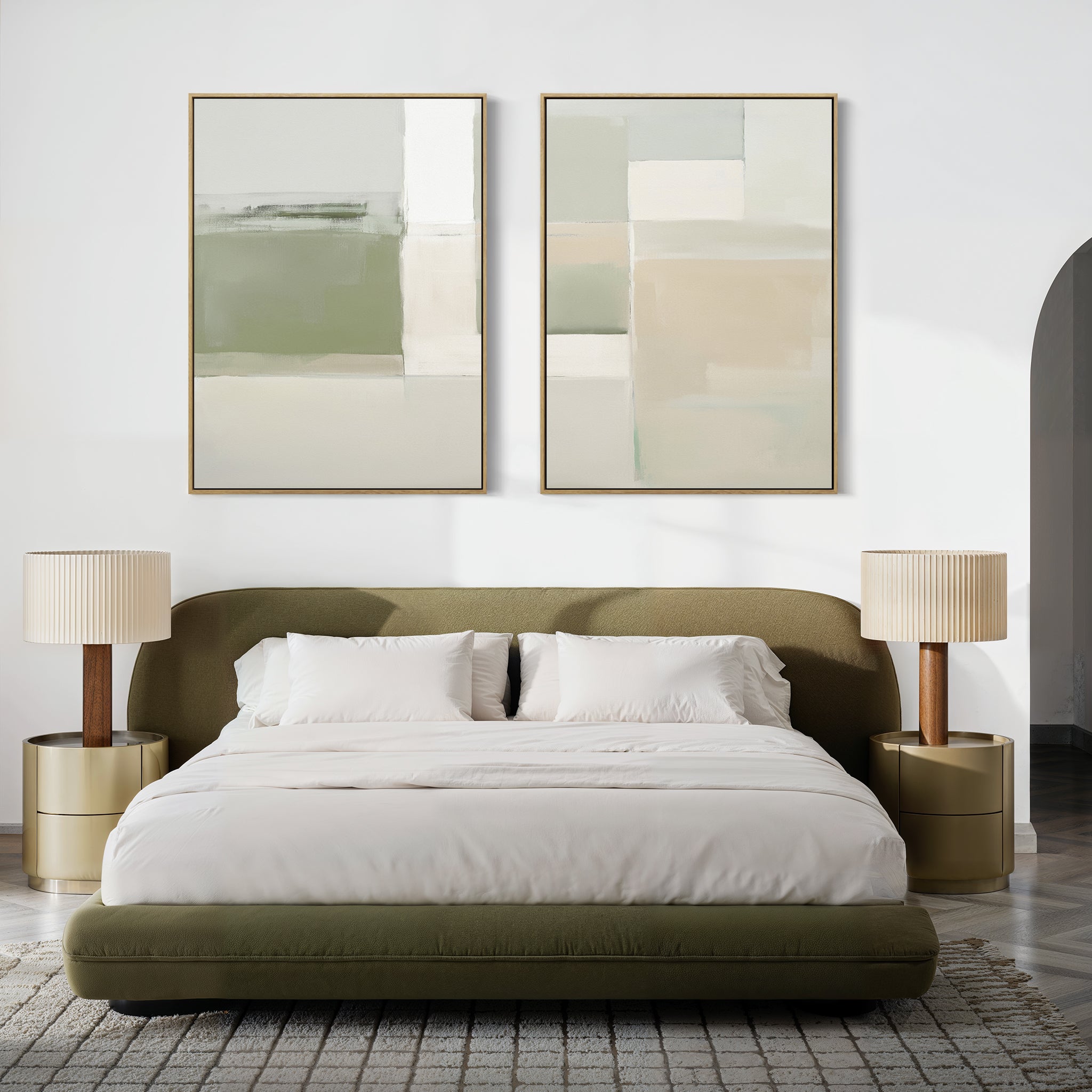 A modern bedroom with an olive green bed, white bedding, two round gold nightstands with beige lamps, and the Soft Geometric Planes - Set Of 2 prints in green and beige hanging above the headboard.
