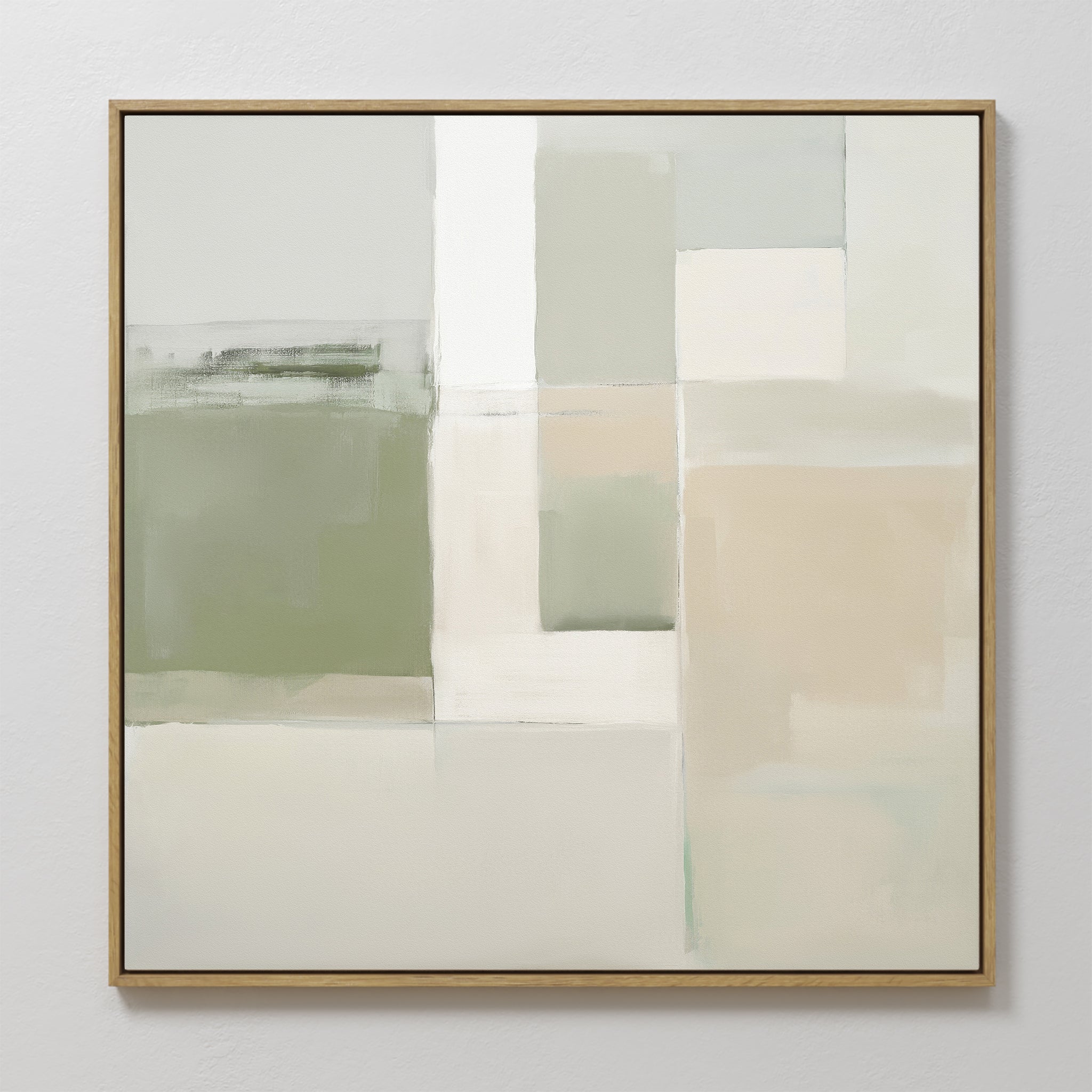 The Soft Geometric Planes Canvas Art - Square features a minimalist abstract design with soft blocks of green, beige, white, and gray. Varied rectangular shapes create calming wall art, all presented in a thin light wood frame.