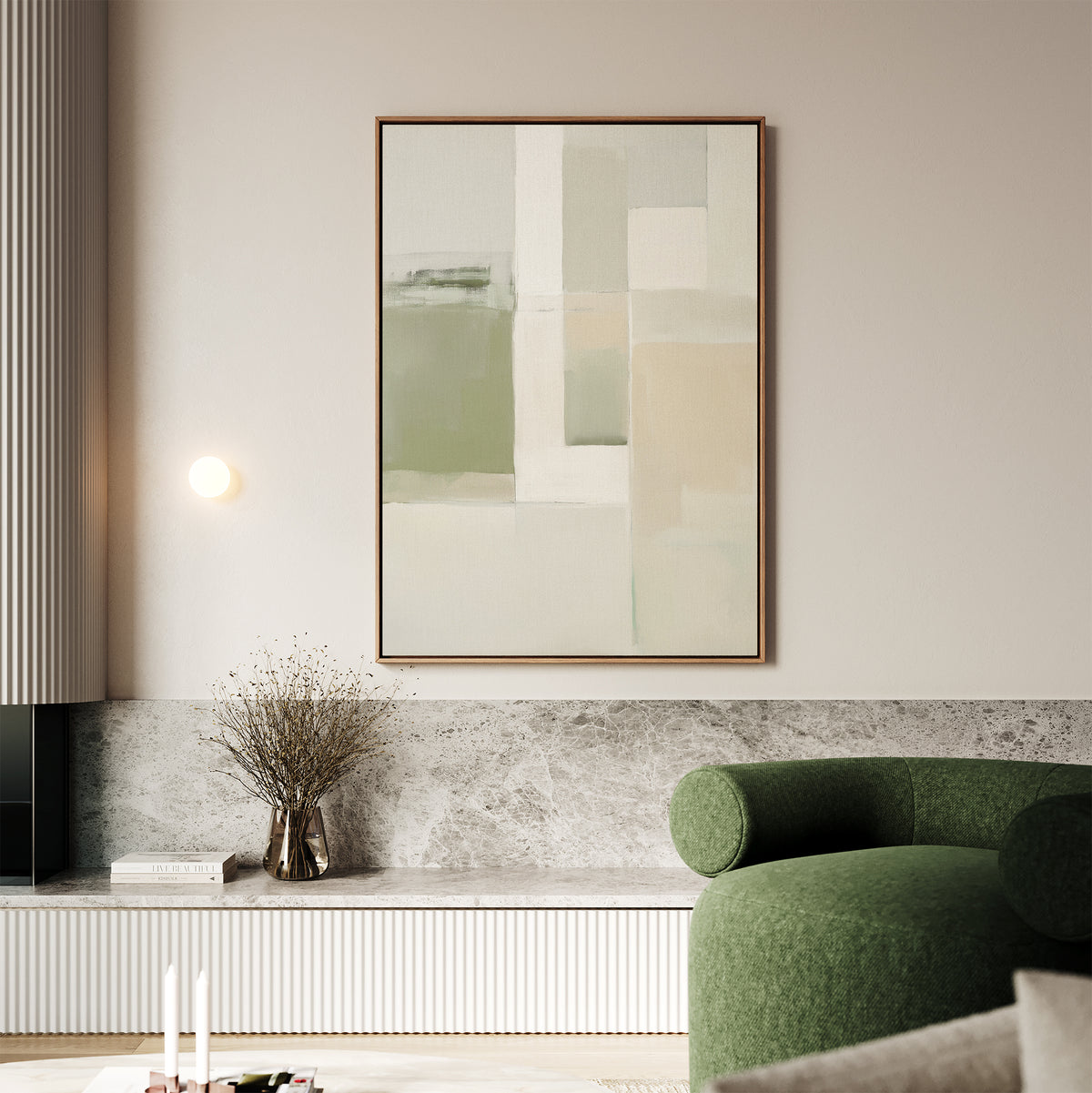 A modern living room features a green curved sofa, marble-topped bench, vase with dried branches, and the Soft Geometric Planes Canvas Art - Vertical in neutral tones on the light wall for a refined contemporary aesthetic.