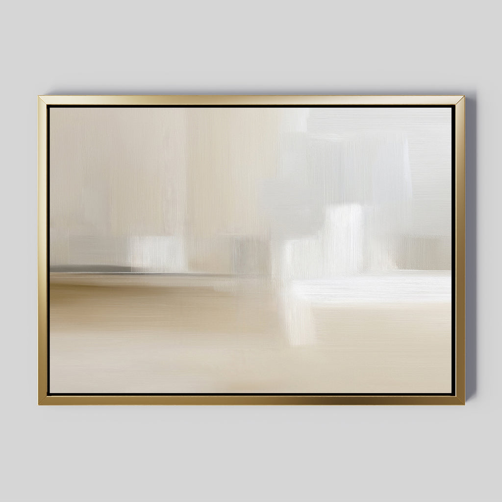 The Soft Layers Canvas Art - Horizontal features a gold-framed abstract design with smooth beige, white, and light gray tones. This minimalist modern print is displayed against a plain gray background for a sophisticated touch.