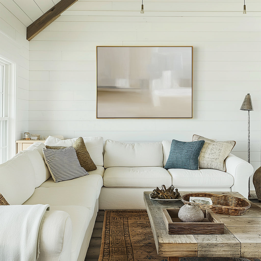 A bright, cozy living room with white shiplap walls, a white sectional with textured pillows, a rustic wooden coffee table, and the Soft Layers Canvas Art - Horizontal on the wall. Neutral tones and natural light create an inviting feel.