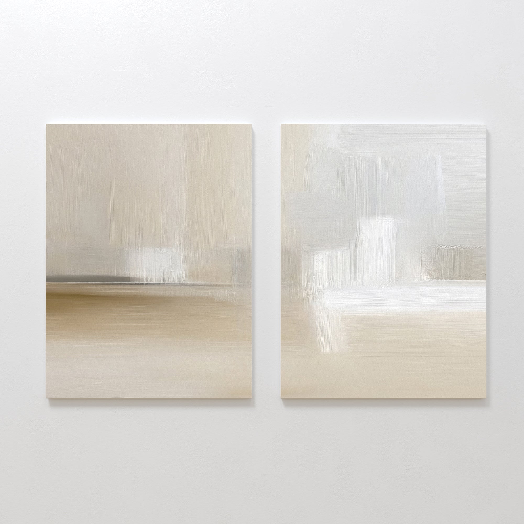 The "Soft Layers - Set Of 2" features abstract artworks with soft, blurred beige, white, and gray brushstrokes displayed side by side on a plain white wall.