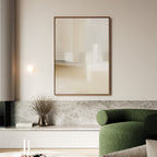 A minimalist living room features a green curved sofa, marble bench, dried flower arrangement in a glass vase, and Soft Layers Canvas Art - Vertical as neutral wall art above, with soft lighting enhancing the calm, modern atmosphere.