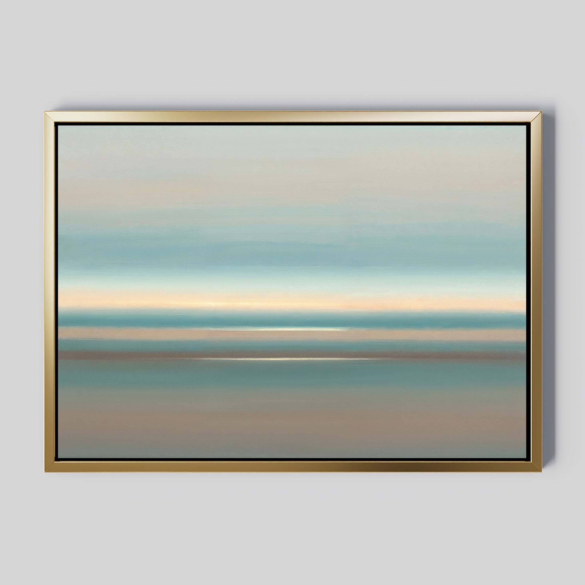 The Soft Tide Layers Canvas Art - Horizontal features abstract landscape bands in soft blue, beige, and gray tones. This calming print is framed with a simple gold border and displayed on a light gray wall.